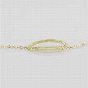 9k yellow gold bracelet with open oblong in white cz