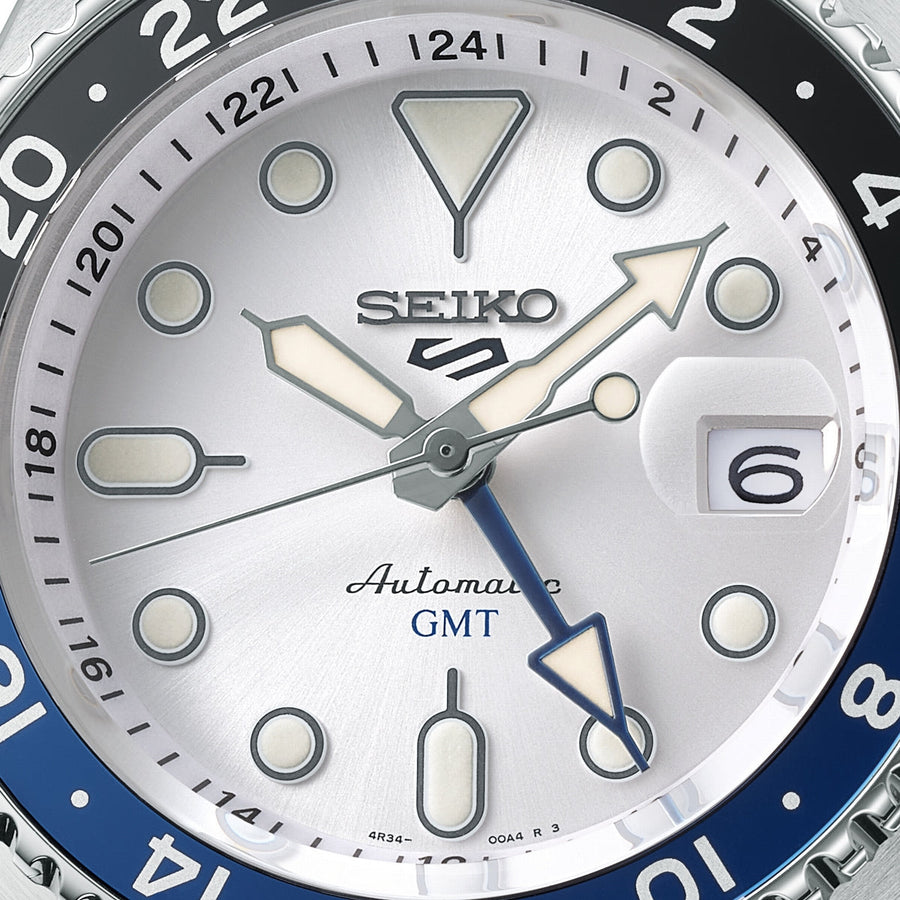 seiko 5 sports skx gmt black & blue bezel with a white dial