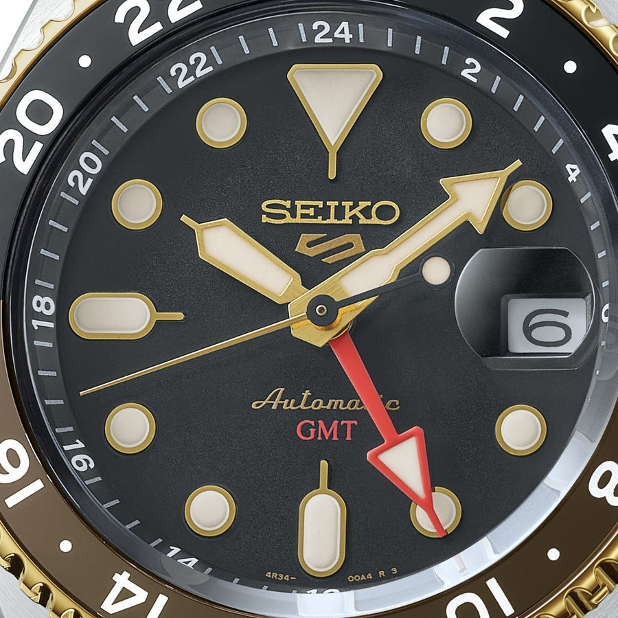 seiko 5 sports skx gmt black & gold bezel with a black dial