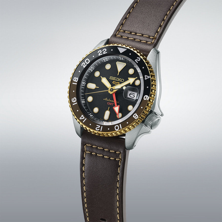 seiko 5 sports skx gmt black & gold bezel with a black dial