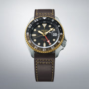 seiko 5 sports skx gmt black & gold bezel with a black dial