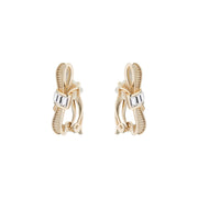 dalika: ribbon bow clip earring pale gold/crystal