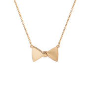 tessla: crystal tux bow gold pendant
