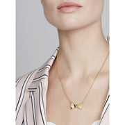 tessla: crystal tux bow gold pendant