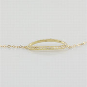 9k yellow gold bracelet with open oblong in white cz